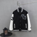 Black and white varsity jacket with snap buttons and ribbed striped cuffs