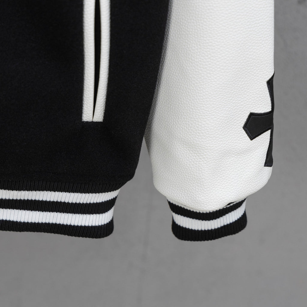 Black-and-white varsity jacket hem with ribbed striped cuffs