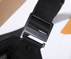 Black belt bag strap hardware with engraved “Louis Vuitton” text