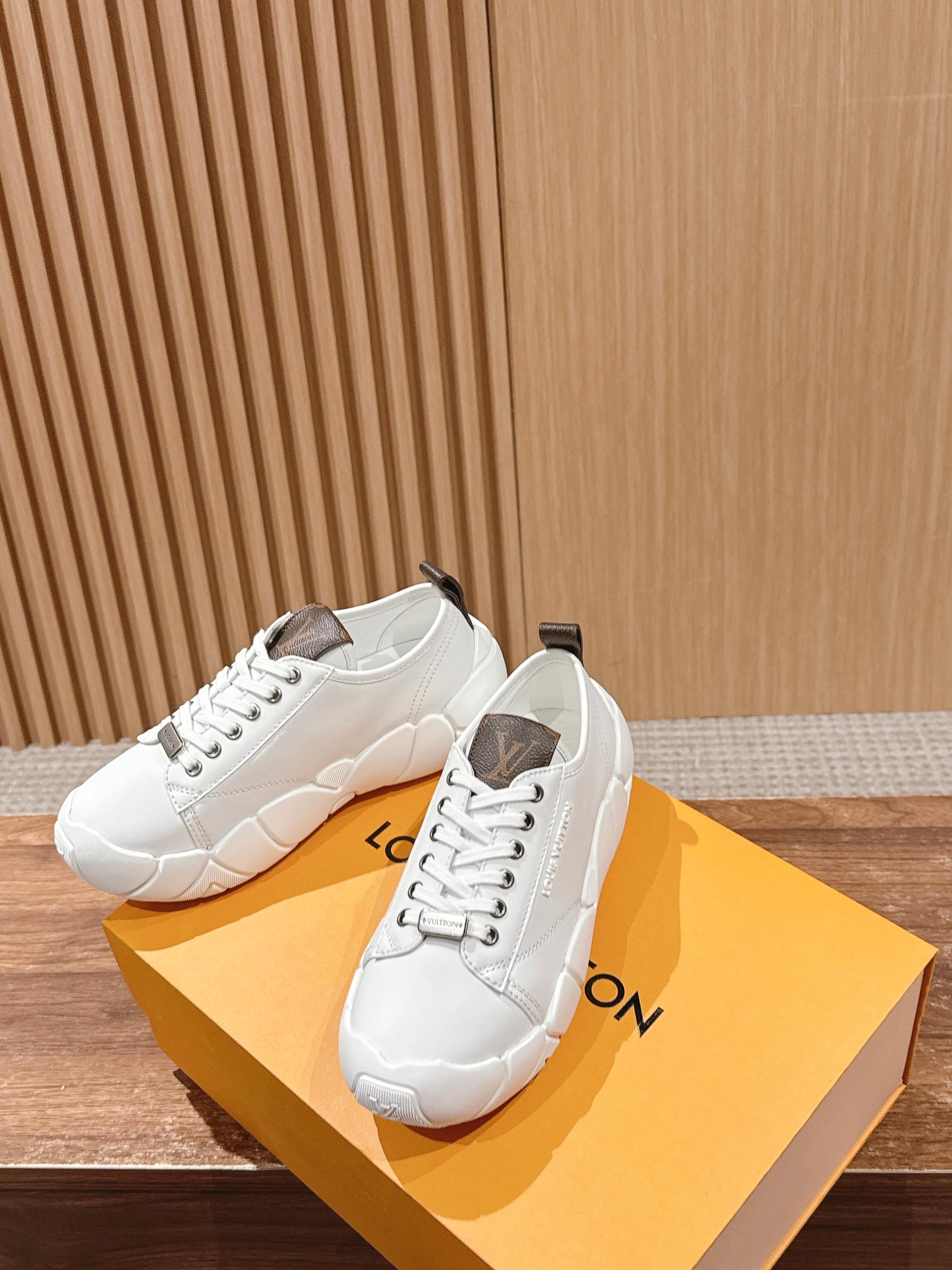 Louis Vuitton unisex sneakers on box, white uppers with brown monogram heel straps
