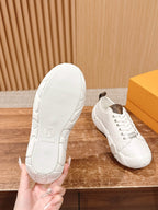 Louis Vuitton unisex sneakers, white sole with embossed logo and side view
