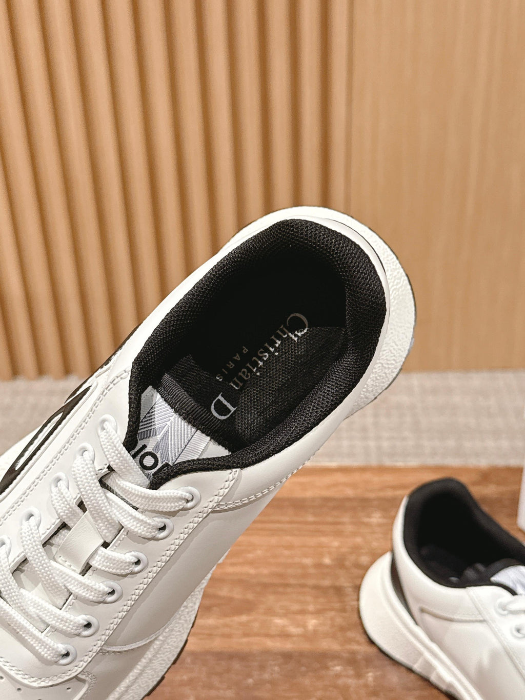 Dior unisex sneakers, white upper with black-lined collar, lace-up, interior view