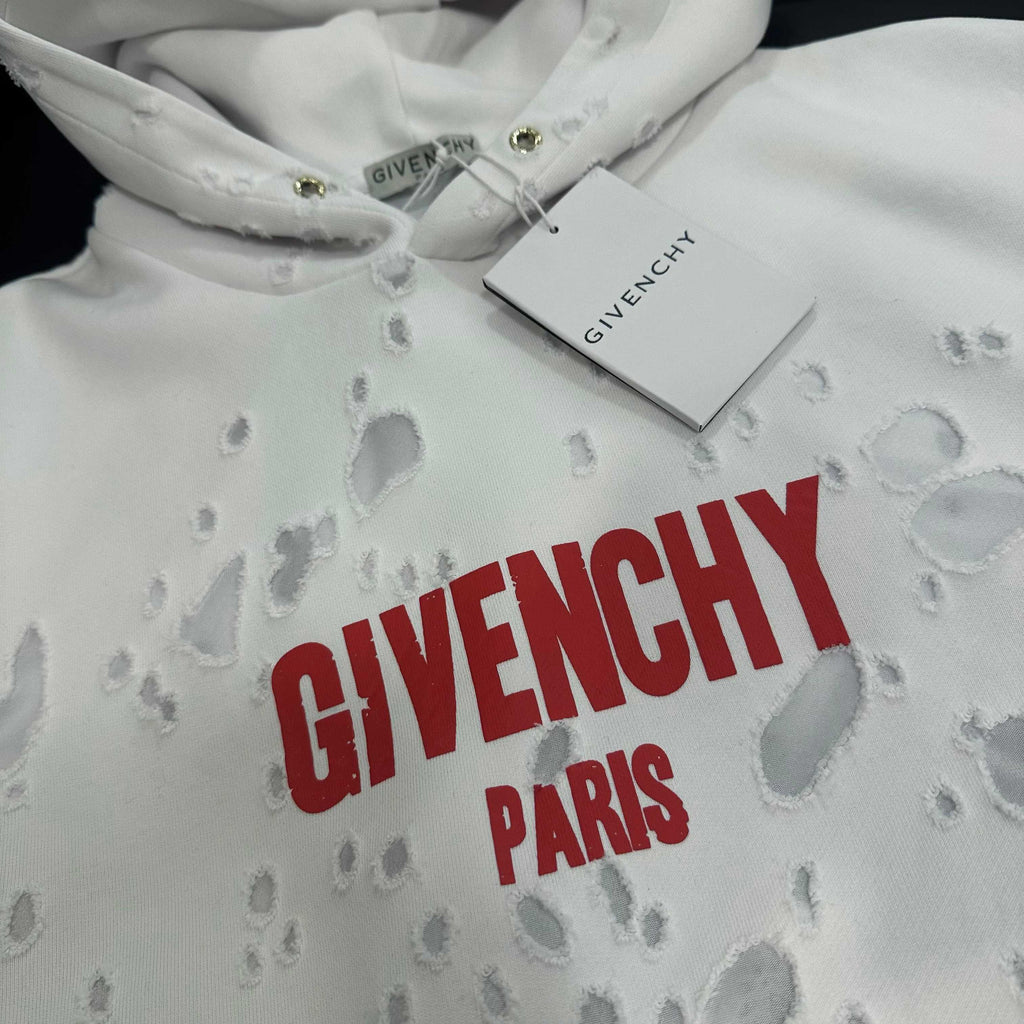 White Givenchy hoodie close-up with red “GIVENCHY PARIS” logo on chest