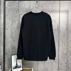 Black crewneck sweatshirt with ribbed cuffs and hem