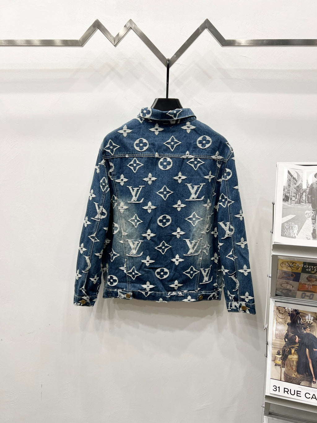 Blue denim jacket with white monogram print, stand collar and full button front
