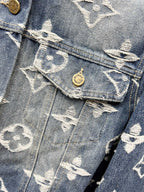Blue denim jacket chest flap pocket with white monogram and round gold button