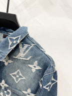 Blue denim jacket shoulder and collar with white monogram pattern