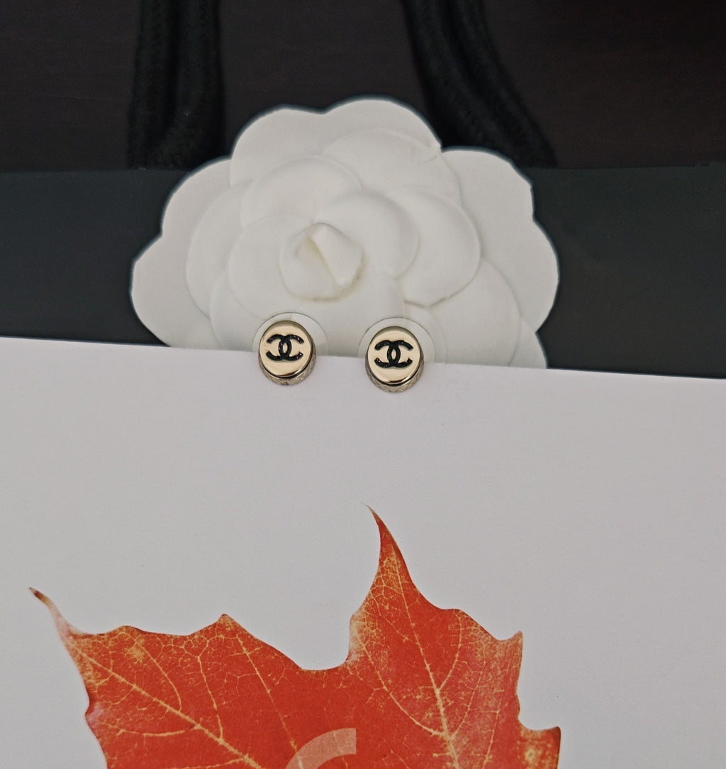 Gold-tone Chanel CC stud earrings, round with black logo on posts