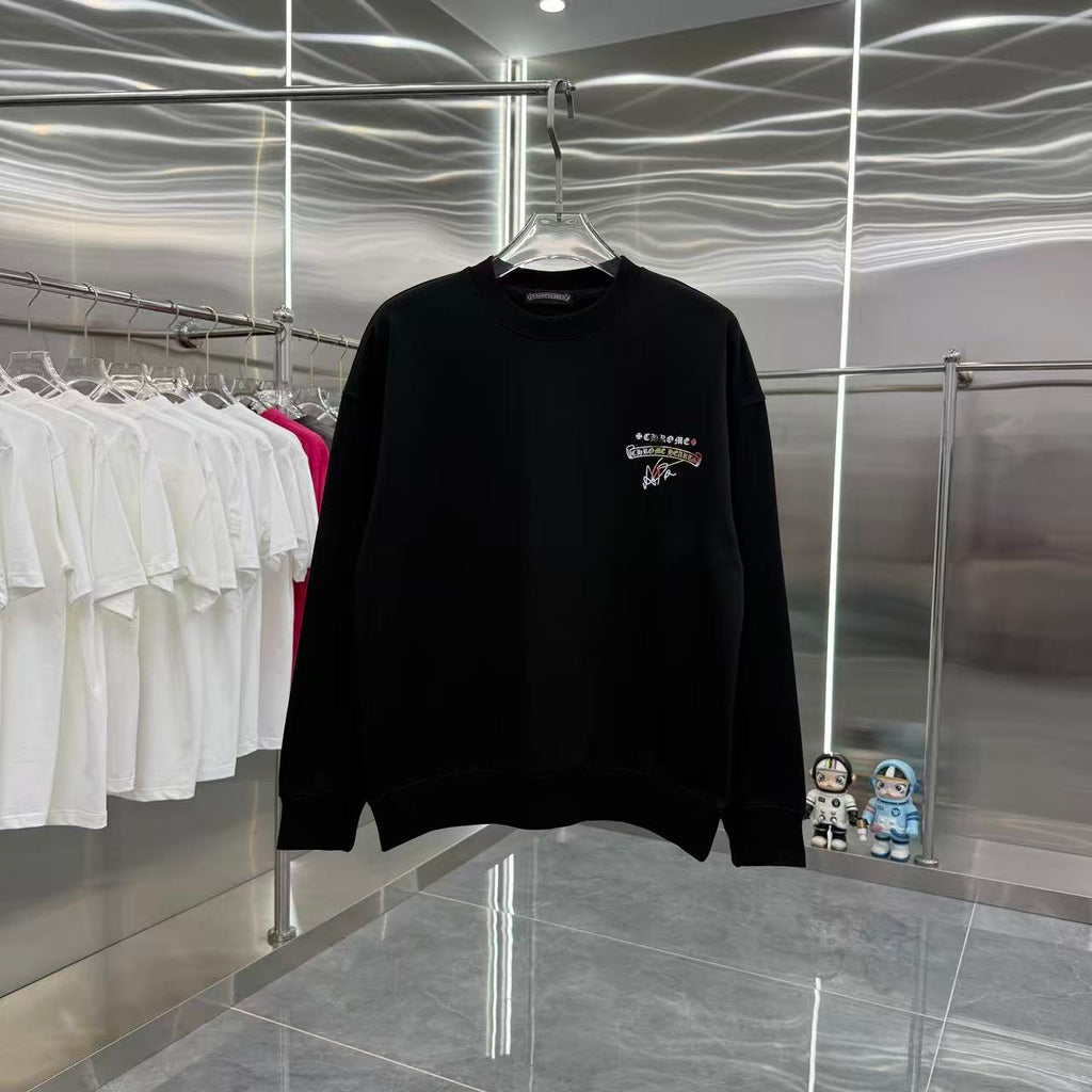 Black long-sleeve crewneck sweatshirt, small multicolor chest graphic.