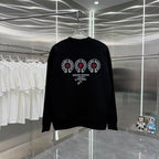 Black long-sleeve crewneck sweatshirt with large circular emblem graphic.