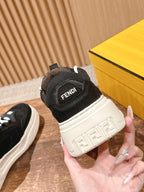 Black Fendi sneaker heel with padded collar and white sole, shown with box
