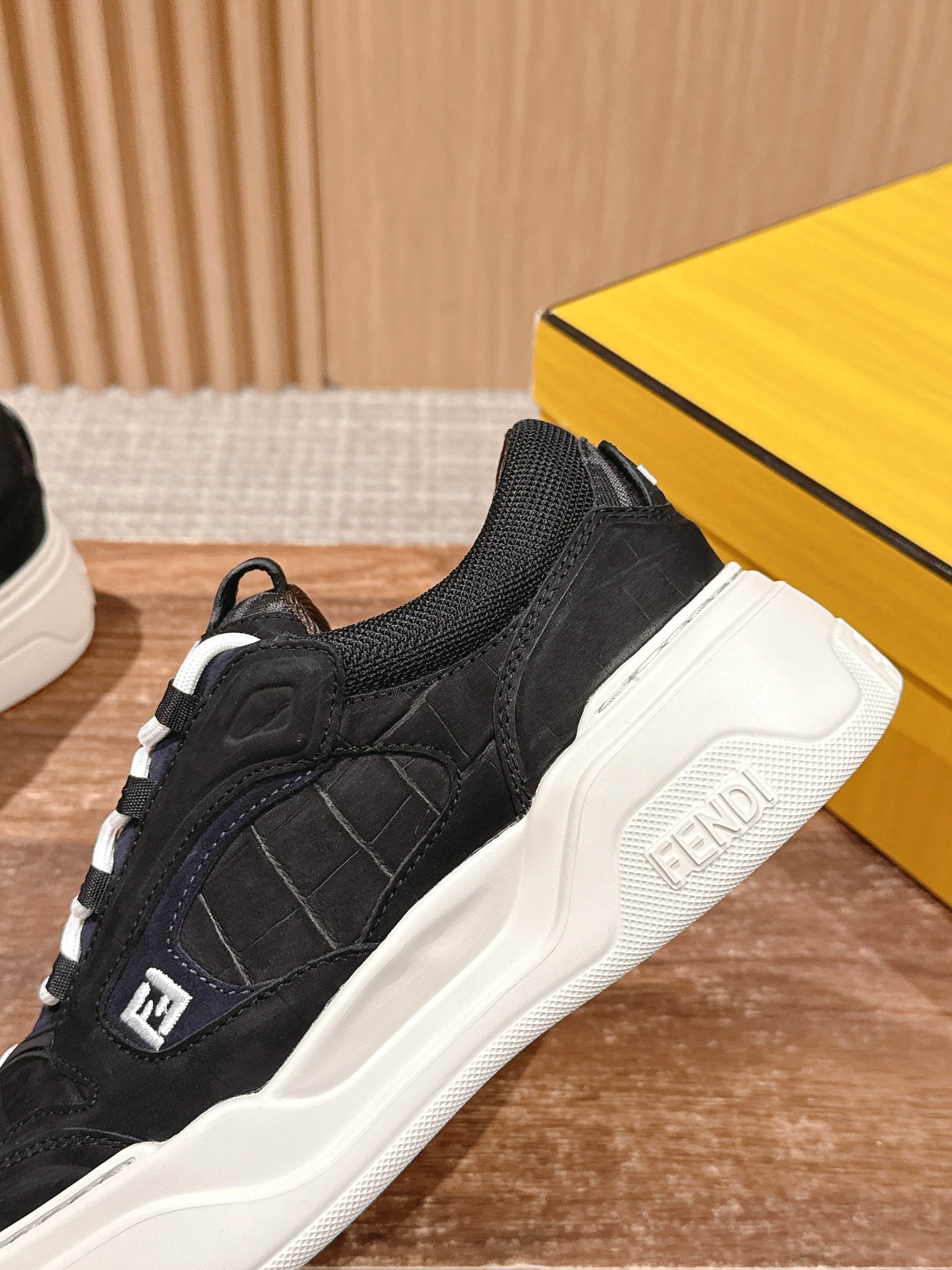 Black Fendi lace-up sneaker with padded collar and white platform midsole
