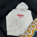 White Givenchy hoodie with red “GIVENCHY PARIS” logo on chest and hood