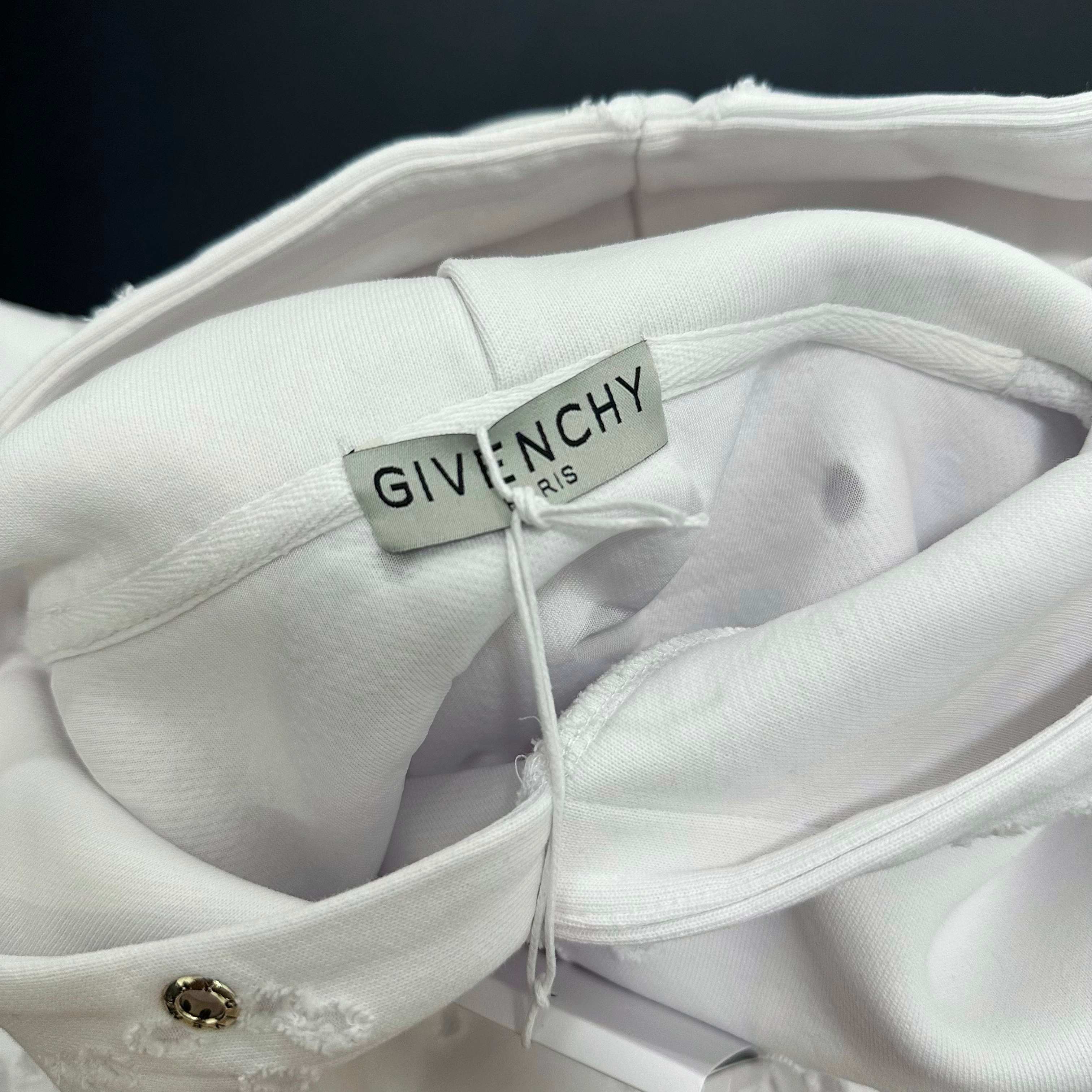 White Givenchy hoodie neckline close-up with inner tag label