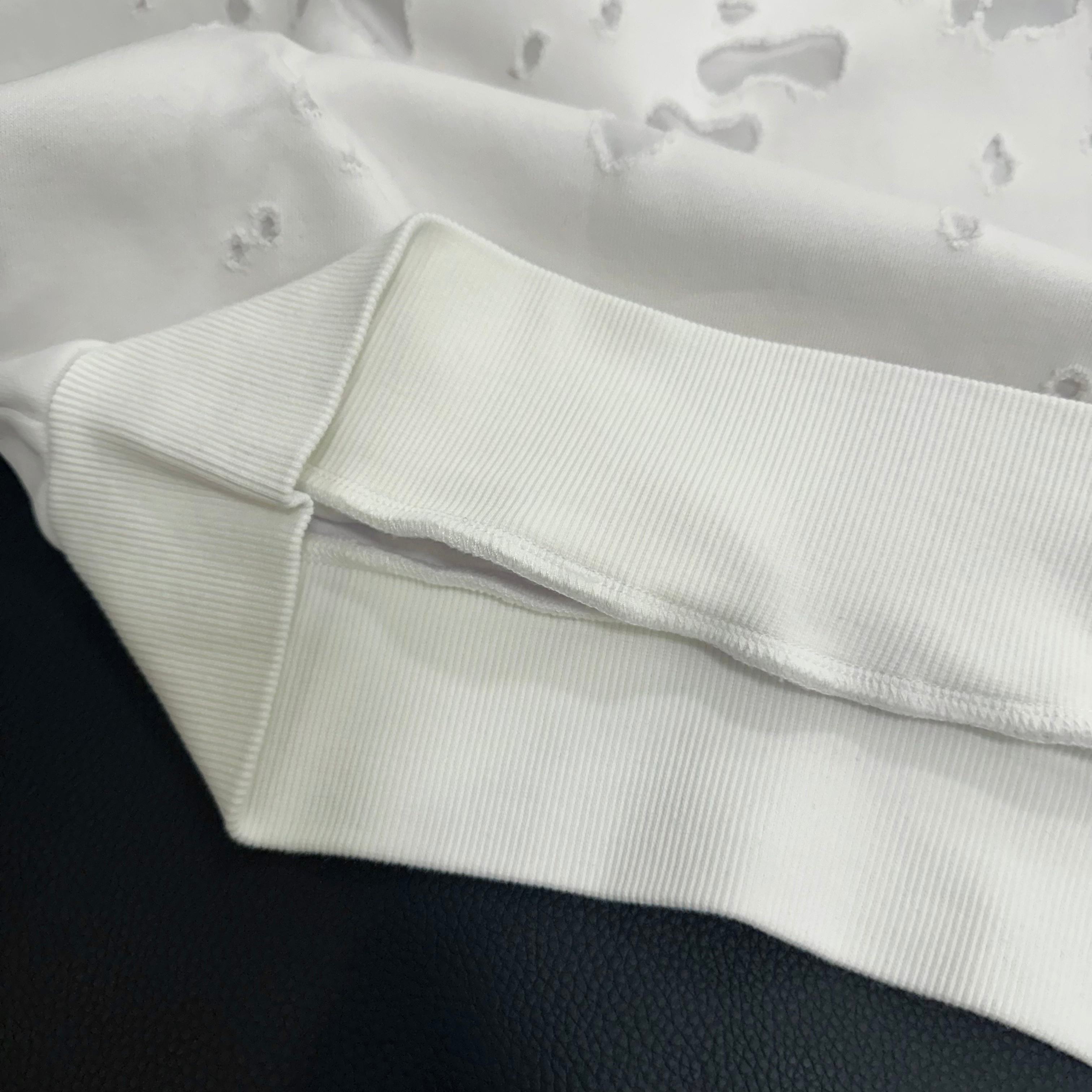 White Givenchy hoodie cuff and hem detail with ribbed trim