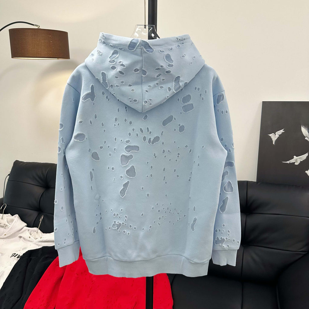 Light blue hoodie with hood and paw-print pattern, back view