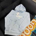 Light blue hoodie with hood, 'GIVENCHY PARIS' logo and hanging tag