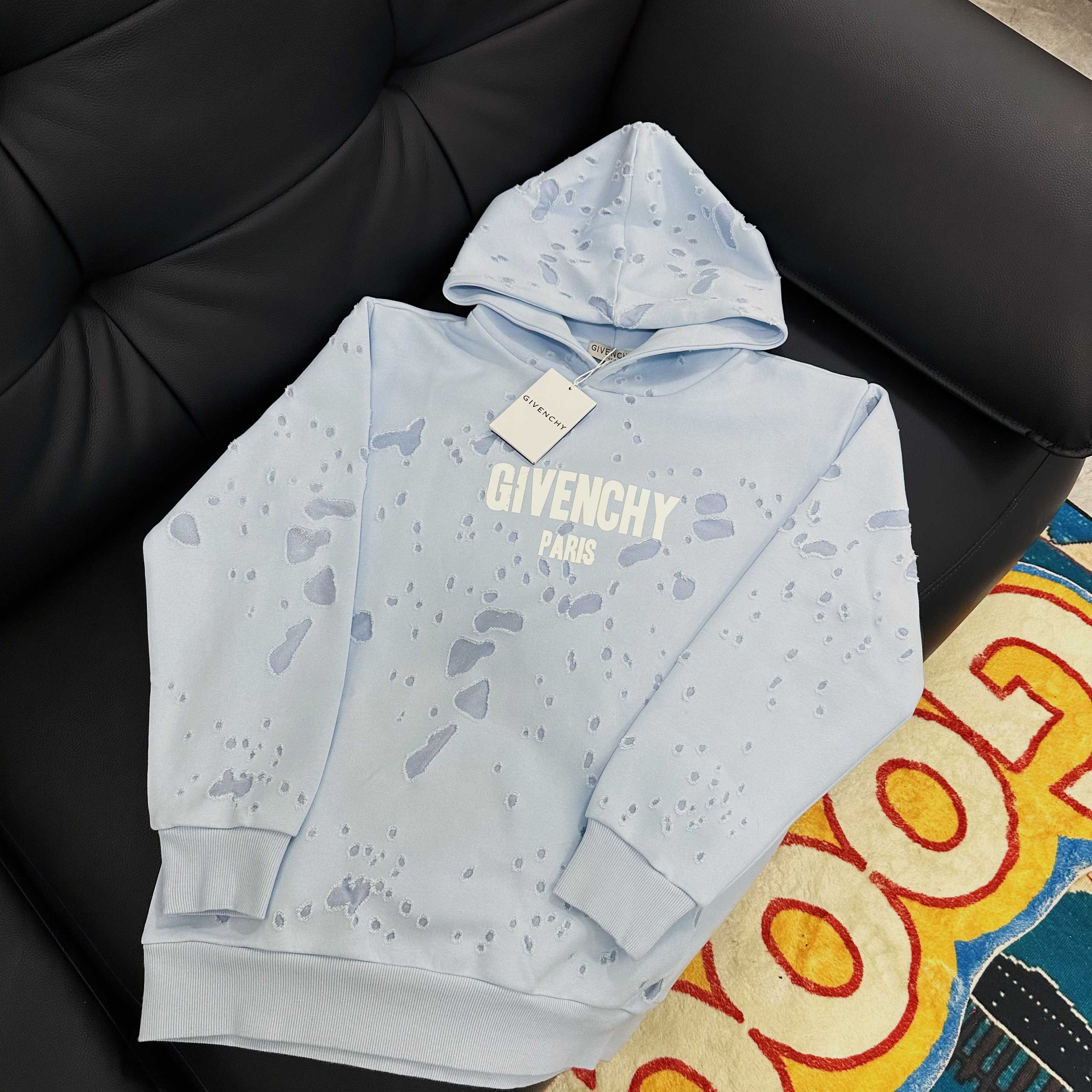 Light blue hoodie with hood, 'GIVENCHY PARIS' logo and hanging tag