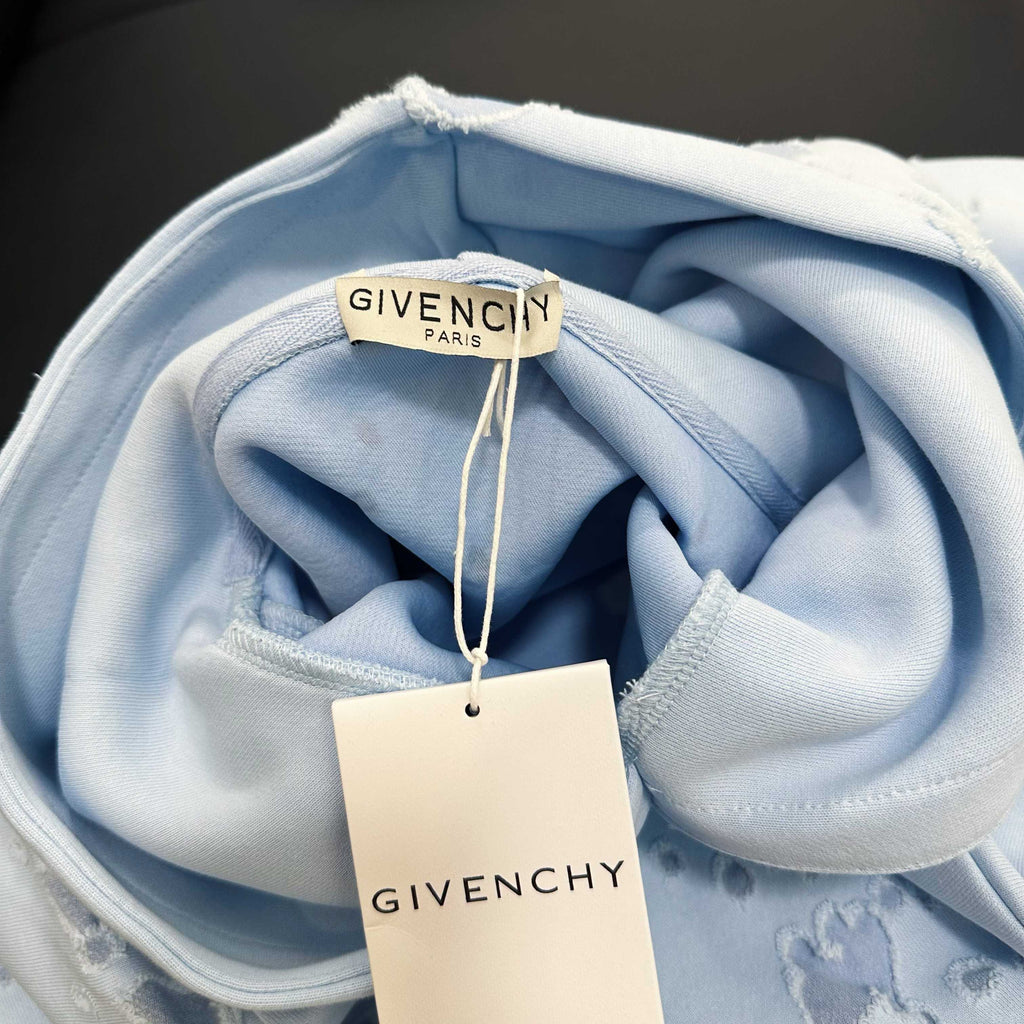 Light blue hoodie hood lining with drawstrings and GIVENCHY Paris hang tag