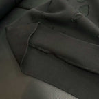 Black hoodie sleeve cuff with ribbed hem and seam detail