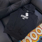 Black Givenchy hoodie with large 'GIVENCHY PARIS' front print and hood