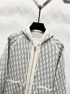 Dior long zip-up hoodie close-up, gray-and-white monogram print with hood and zipper