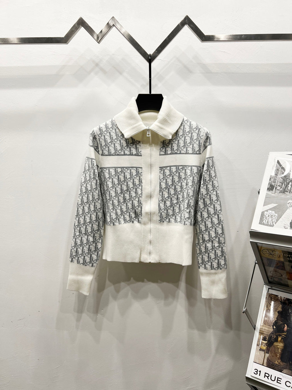 White Dior zip jacket with stand collar and repeating monogram pattern
