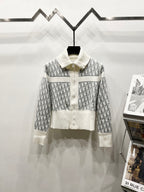 White Dior zip jacket with stand collar and repeating monogram pattern