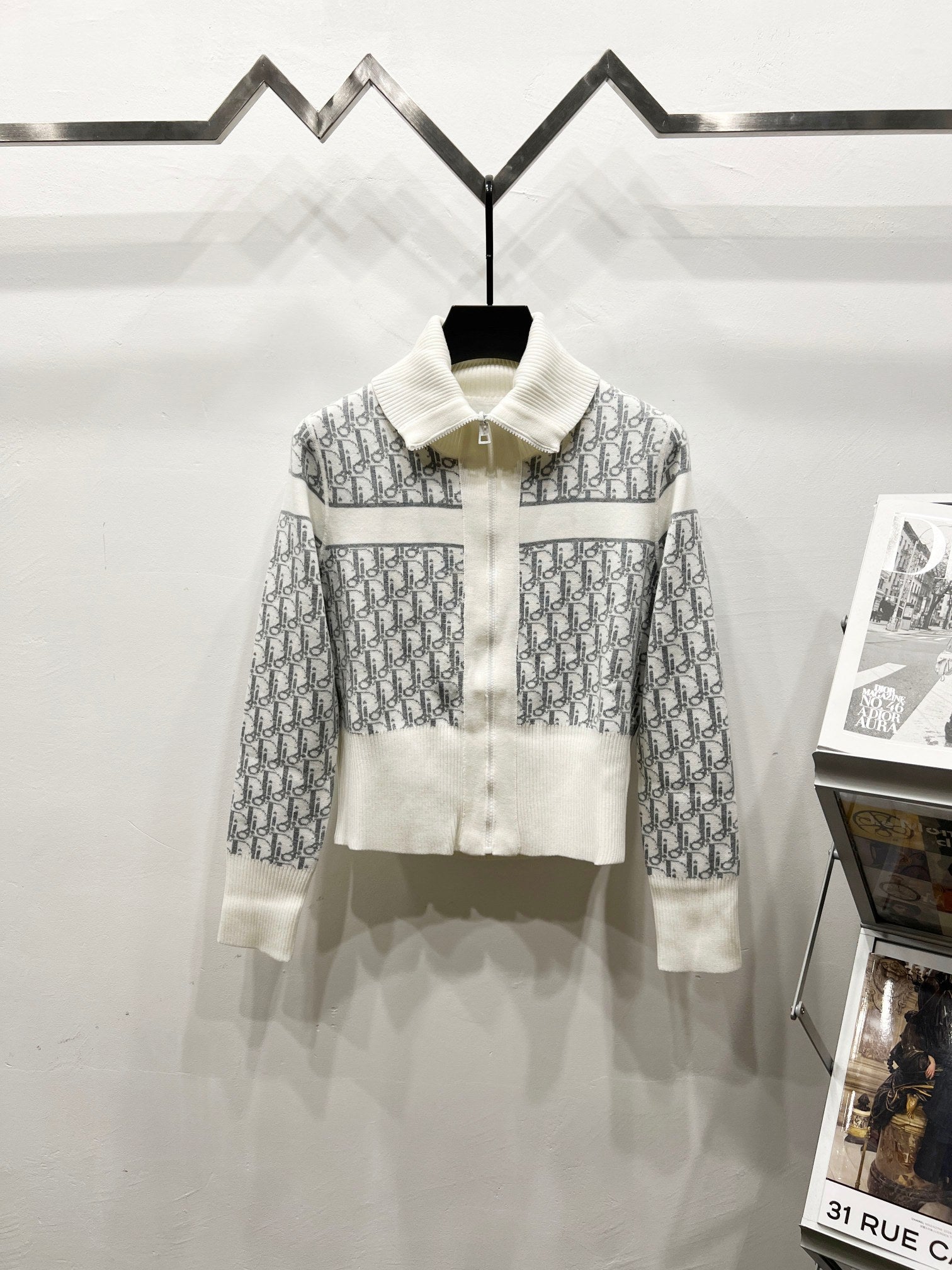 White Dior zip jacket with stand collar and repeating monogram pattern