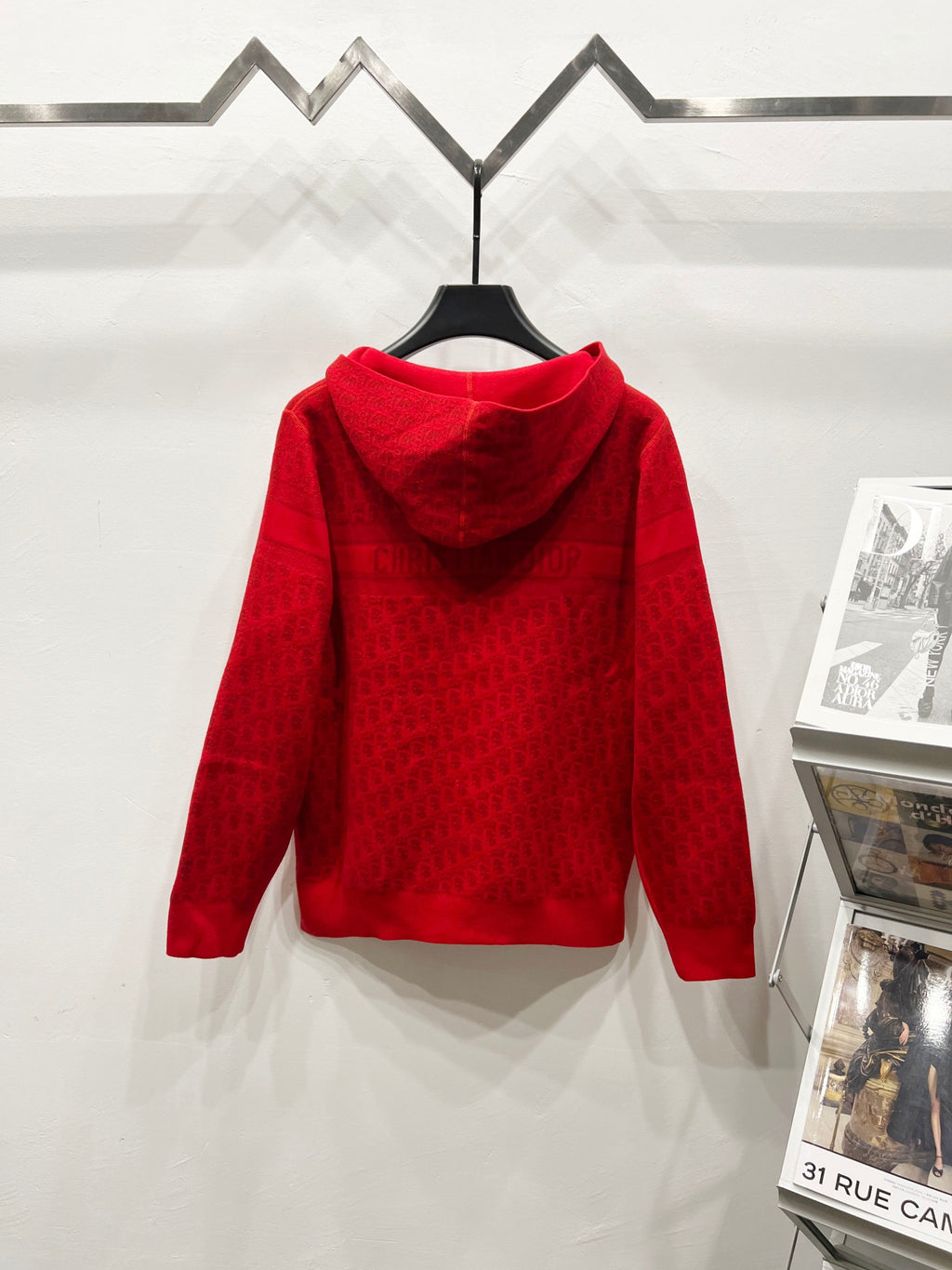 Red zip-front hooded sweatshirt, back view with repeating jacquard logo pattern