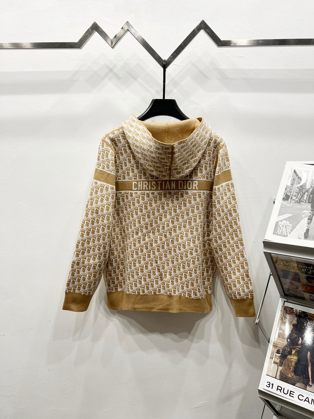 Tan hooded zip sweatshirt with Dior text across the back