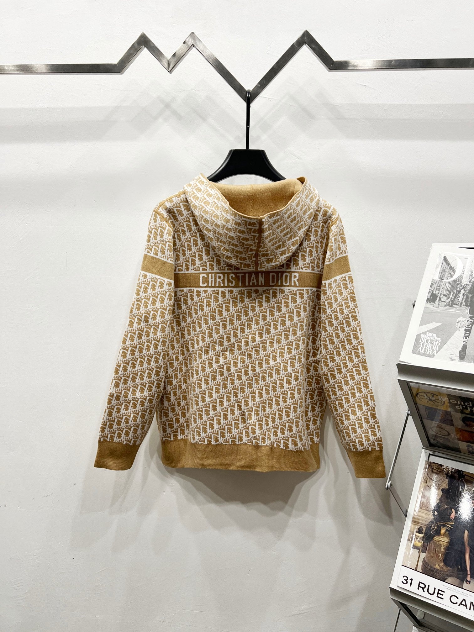 Tan hooded zip sweatshirt with Dior text across the back