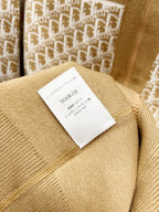 Tan fabric garment label on knit hooded sweatshirt