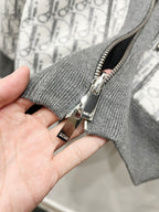 Dior zipper pull on gray knit zip hoodie, metal pull and brand tag