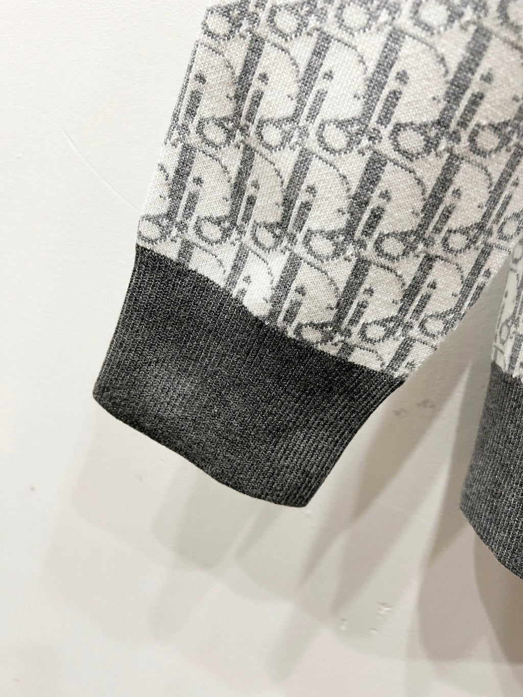 Dior monogram knit sleeve hem with dark ribbed cuff, light gray