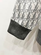 Dior monogram knit sleeve hem with dark ribbed cuff, light gray
