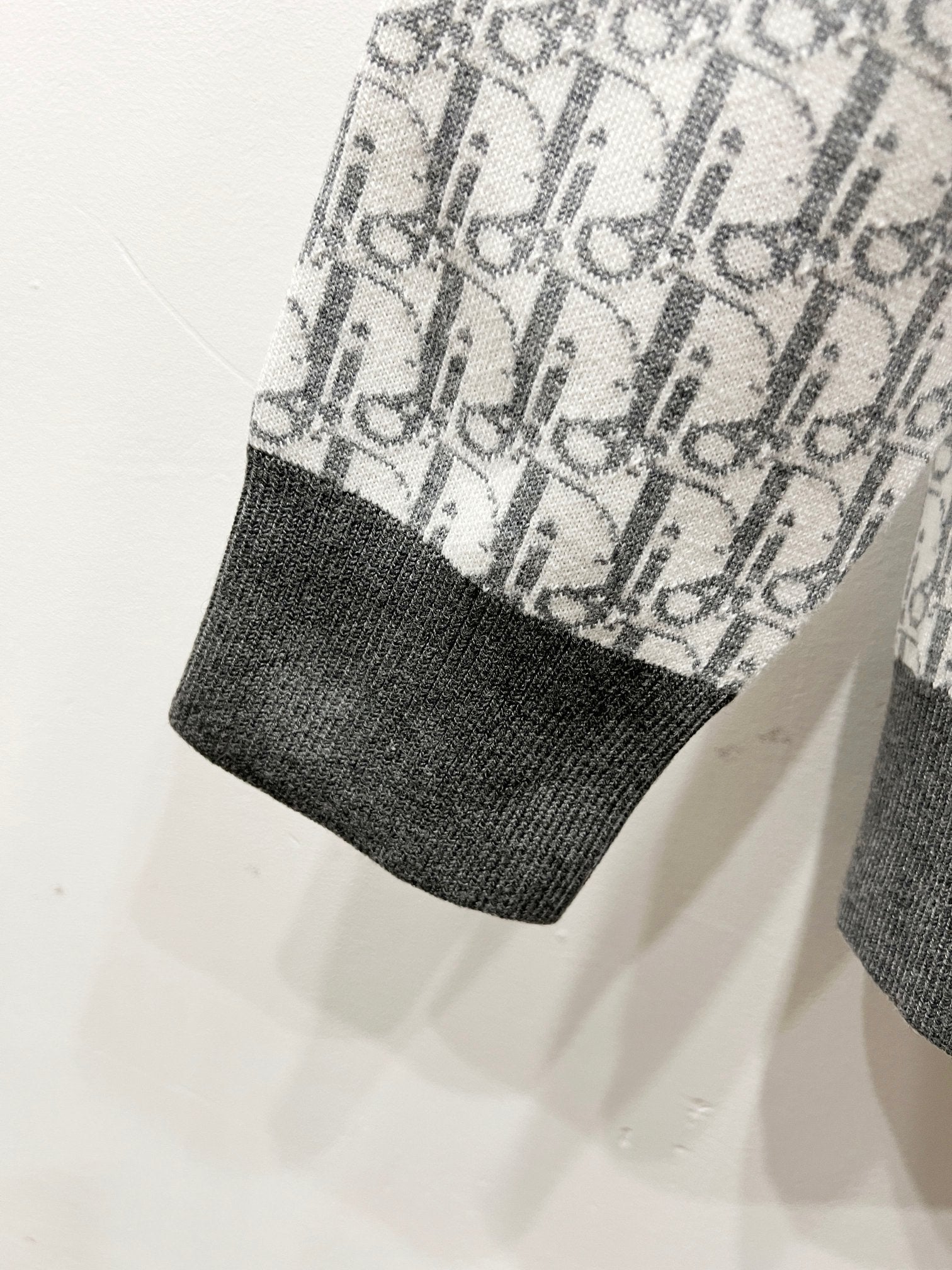 Dior monogram knit sleeve hem with dark ribbed cuff, light gray
