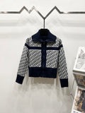 Navy and white long-sleeve zip jacket with stand collar and repeating logo pattern