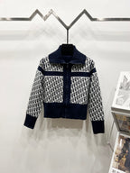 Navy and white long-sleeve zip jacket with stand collar and repeating logo pattern