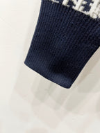 Navy knit sleeve cuff with ribbed hem