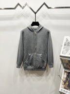 Grey zip-up hoodie with drawstring hood and side pockets, full monogram pattern