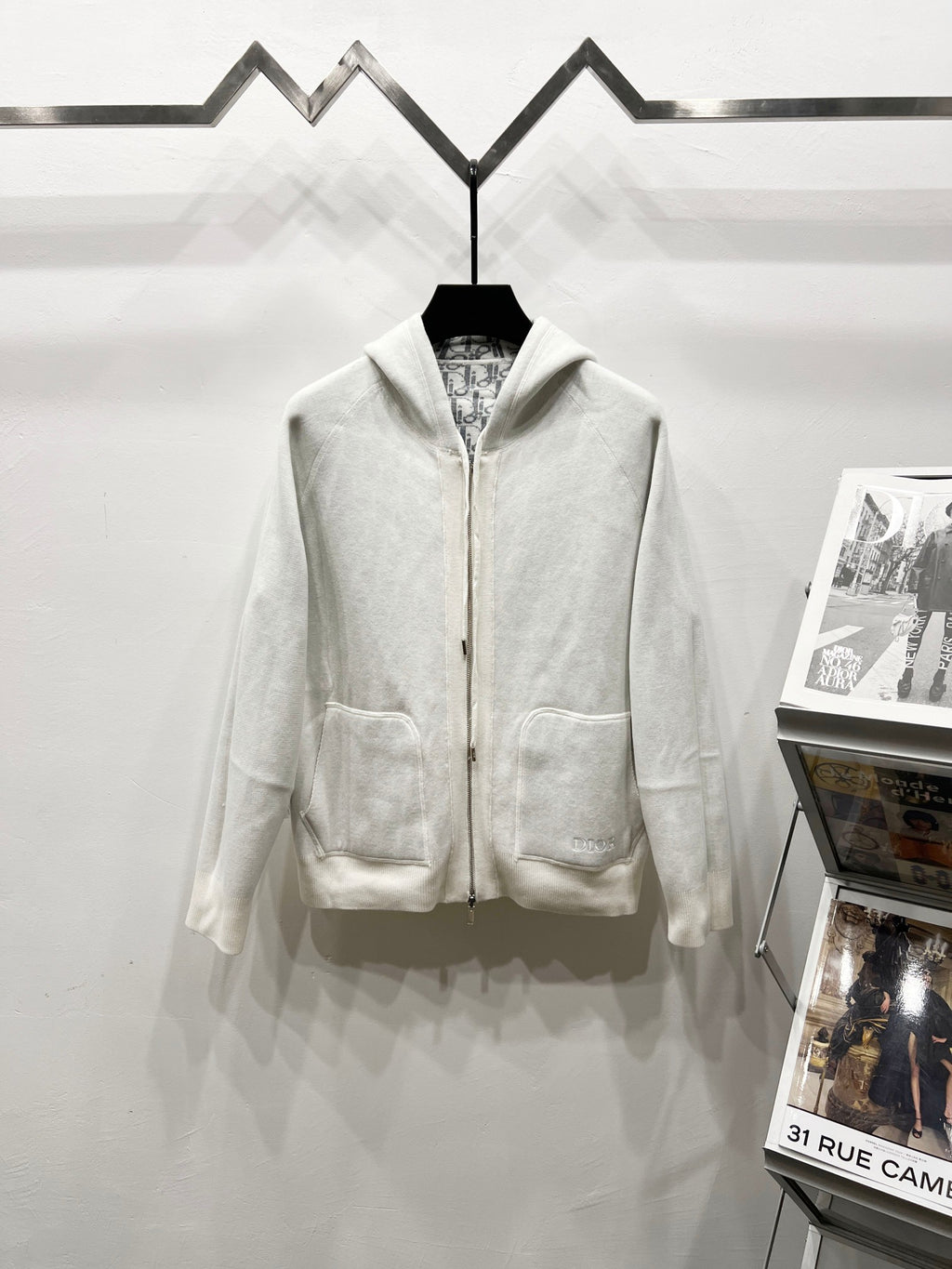 Dior long zip-up hoodie in cream, with hood, front zipper, and patch pockets