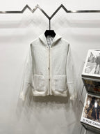 Dior long zip-up hoodie in cream, with hood, front zipper, and patch pockets