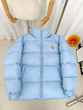 Light blue puffer jacket with zip front and Moncler logo patch on chest