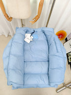Light blue puffer jacket with zip front, quilted padding, and Moncler logo patch