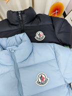 Light blue and dark puffer jackets with zip fronts and Moncler logo patches