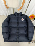 Moncler dark puffer jacket with full front zipper and embroidered logo patch