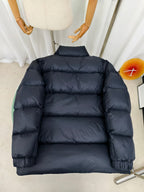 Moncler dark puffer jacket back view with horizontal quilting