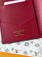 Small bag close-up of pink leather with “Louis Vuitton” stamp