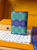 Small bag with turquoise and purple monogram print, front view